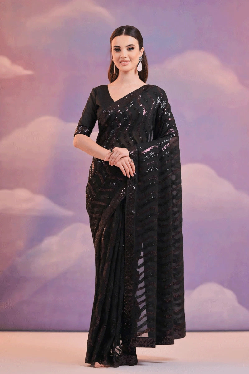 black saree with purple patta 