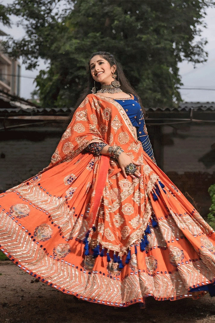 full sleeve blue blouse with orange chaniya choli