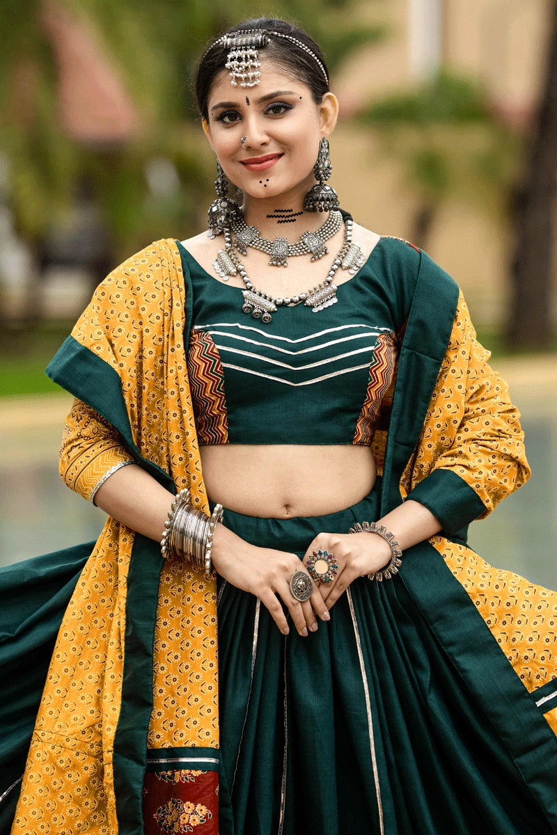 dark green lehenga with yellow dupatta for women