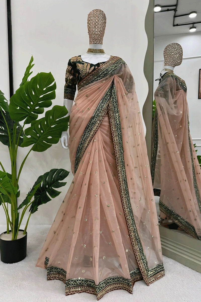 heavy border in peach colour saree